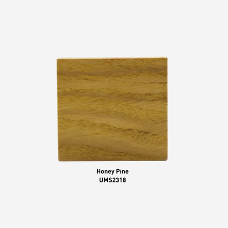 Wooden sample with 'Honey Pine' label and UMS2318 code on a white background